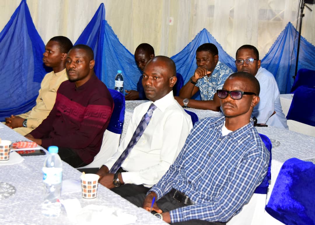 Attendees seated in rows, listening to the conversation