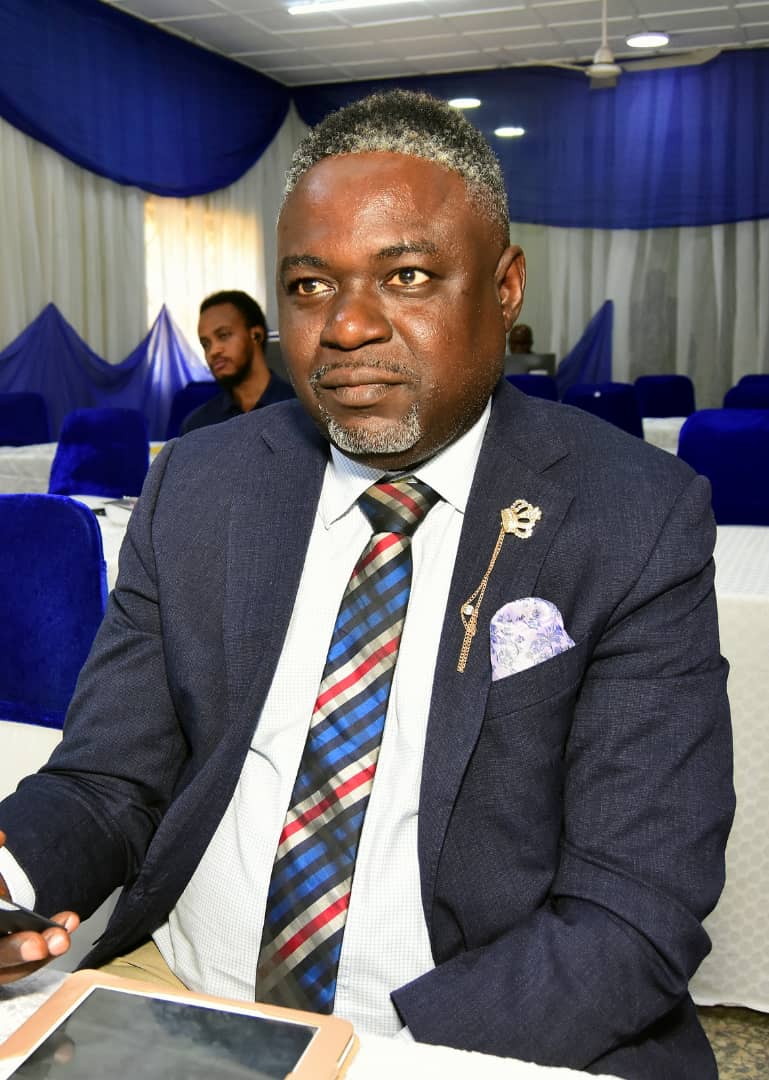 An attendee seated in the gathering venue